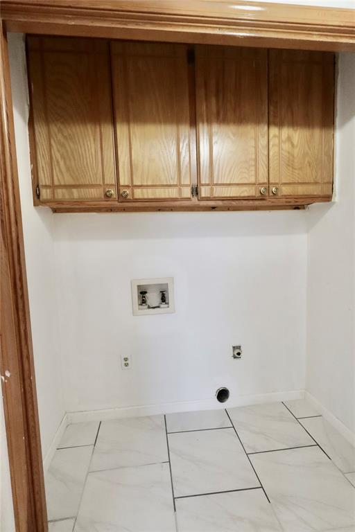 108174 N 3818th Rd, Okemah, OK 74859 - washroom featuring cabinet space, washer hookup, baseboards, and hookup for an electric dryer