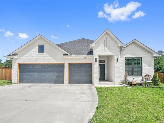 11127 E Sewell Ave, Choctaw, OK 73020 - view of front of house with brick siding, a garage, concrete driveway, and roof with shingles