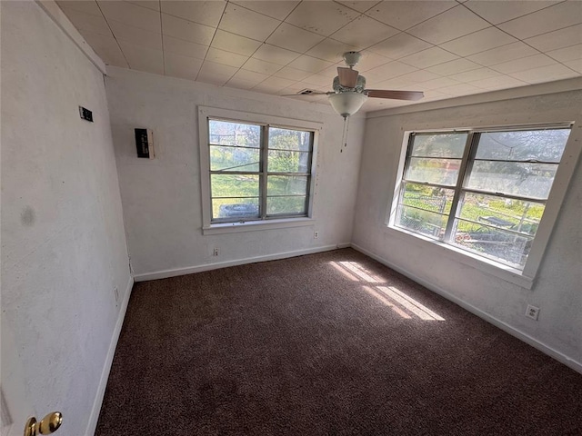424 Jefferson St, Seminole, OK 74868 - carpeted empty room with baseboards and ceiling fan