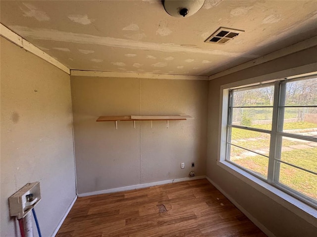 424 Jefferson St, Seminole, OK 74868 - spare room with wood finished floors and baseboards