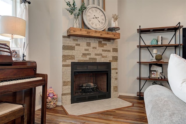 4236 Notting Hill Dr, Moore, OK 73160 - detailed view of wood finished floors, a fireplace with flush hearth, and baseboards