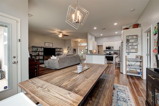 4236 Notting Hill Dr, Moore, OK 73160 - dining space featuring a ceiling fan, a chandelier, dark wood-type flooring, and recessed lighting