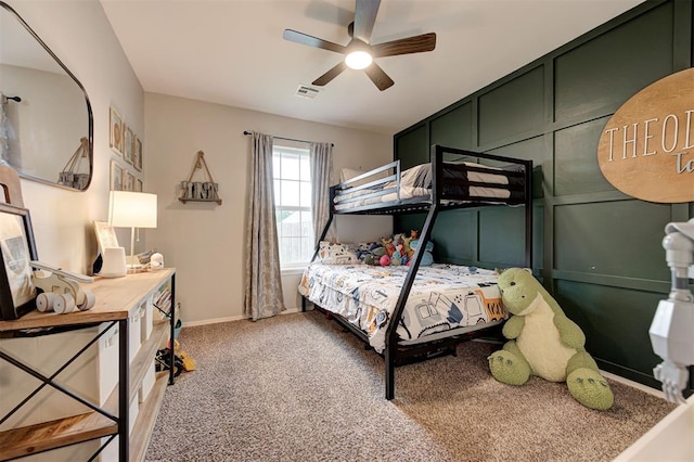 4236 Notting Hill Dr, Moore, OK 73160 - bedroom with carpet flooring, ceiling fan, baseboards, and a decorative wall