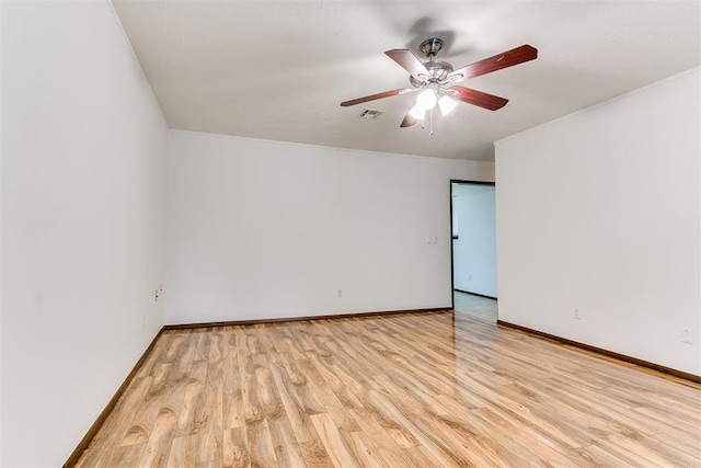 7620 NW 28th Ter, Bethany, OK 73008 - unfurnished room with wood finished floors, baseboards, a ceiling fan, and ornamental molding