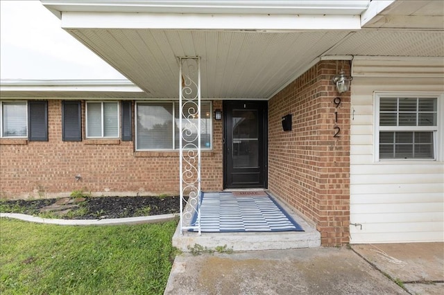 912 SW 4th Pl, Moore, OK 73160 - doorway to property featuring brick siding