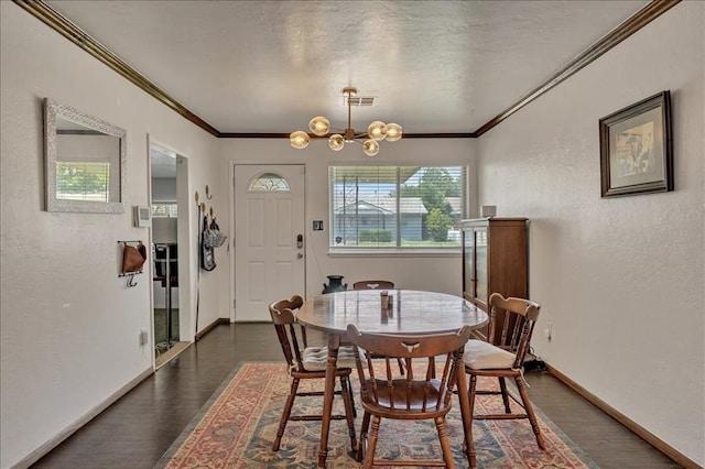 912 SW 4th Pl, Moore, OK 73160 - dining room featuring dark wood-type flooring, baseboards, crown molding, a chandelier, and a textured wall
