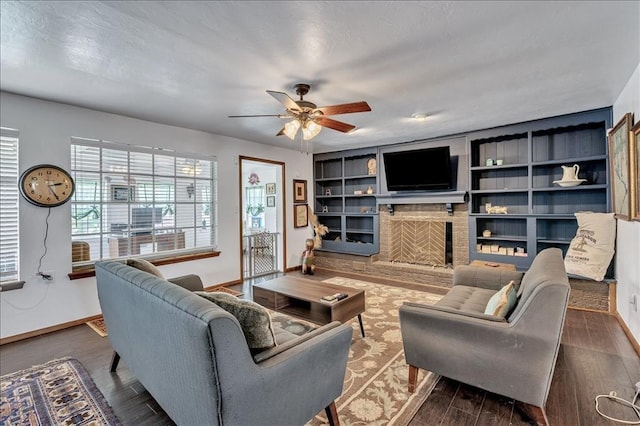 912 SW 4th Pl, Moore, OK 73160 - living room with baseboards, a fireplace, wood finished floors, and a ceiling fan