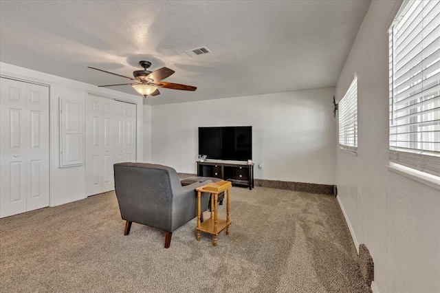 912 SW 4th Pl, Moore, OK 73160 - carpeted living area featuring ceiling fan and baseboards