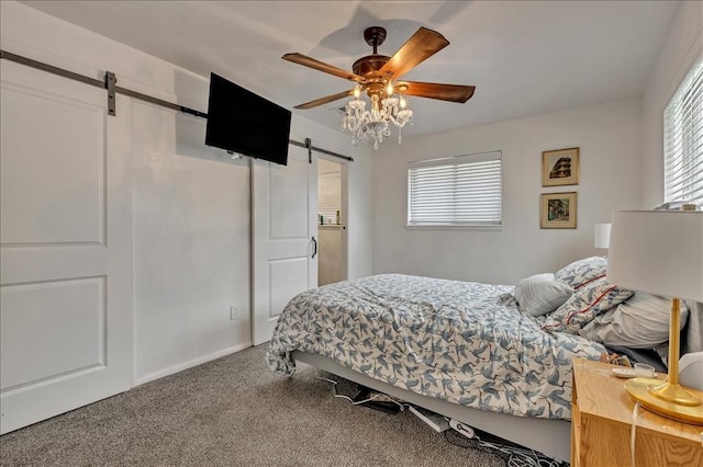 912 SW 4th Pl, Moore, OK 73160 - carpeted bedroom featuring a barn door, multiple windows, and ceiling fan