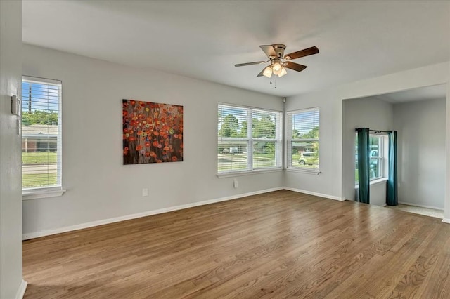 615 Ridgecrest Rd, Edmond, OK 73013 - spare room featuring a ceiling fan, plenty of natural light, and wood finished floors
