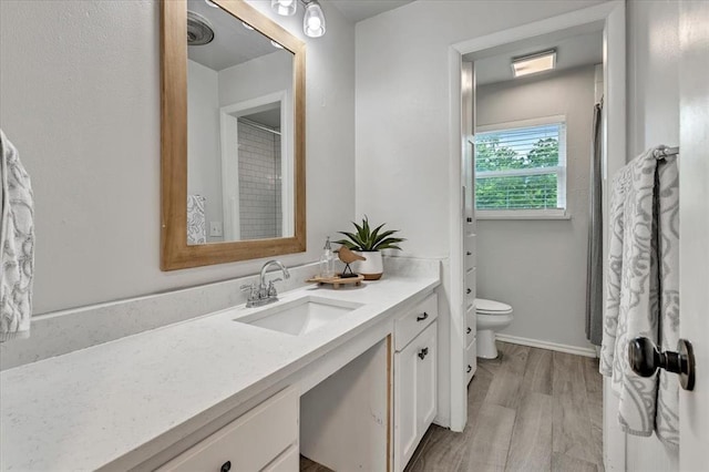 615 Ridgecrest Rd, Edmond, OK 73013 - bathroom featuring vanity, toilet, and wood finished floors
