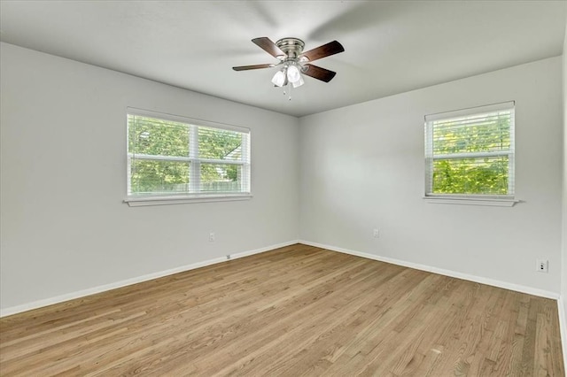 615 Ridgecrest Rd, Edmond, OK 73013 - spare room featuring baseboards, light wood-type flooring, and a ceiling fan