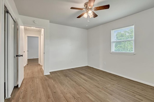 615 Ridgecrest Rd, Edmond, OK 73013 - empty room featuring baseboards, wood finished floors, attic access, ceiling fan, and a smoke detector