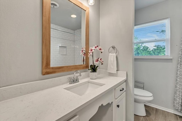 615 Ridgecrest Rd, Edmond, OK 73013 - bathroom with vanity, toilet, baseboards, and a shower