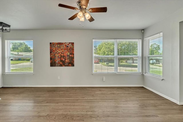 615 Ridgecrest Rd, Edmond, OK 73013 - spare room featuring wood finished floors, plenty of natural light, and ceiling fan