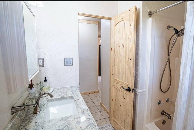 106049 N 3855-1 Rd, Weleetka, OK 74880 - bathroom featuring shower / washtub combination, vanity, tile patterned floors, and a textured wall
