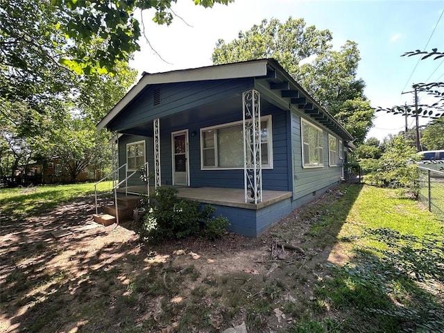 811 N Broadway St, Broken Bow, OK 74728 - view of side of property with a porch and crawl space