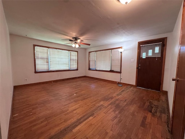 811 N Broadway St, Broken Bow, OK 74728 - foyer entrance with wood finished floors, ceiling fan, and baseboards