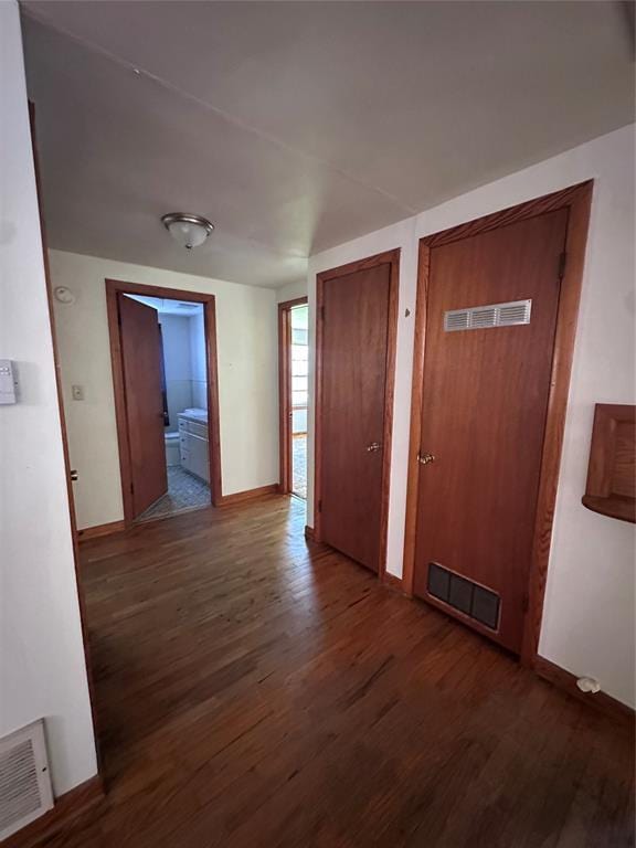 811 N Broadway St, Broken Bow, OK 74728 - hallway featuring wood finished floors and baseboards