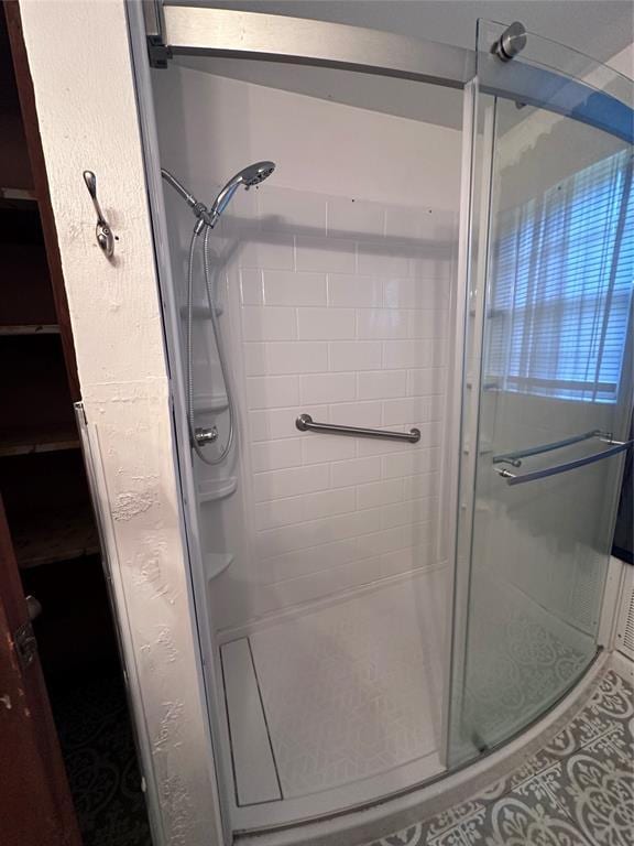 811 N Broadway St, Broken Bow, OK 74728 - bathroom featuring a stall shower and tile patterned floors