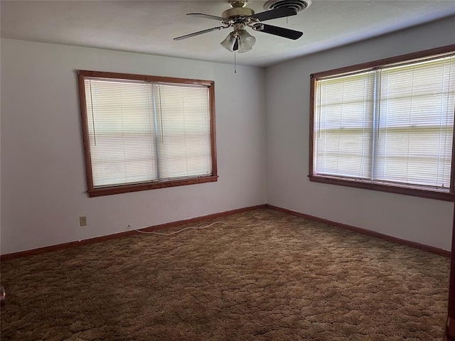 811 N Broadway St, Broken Bow, OK 74728 - carpeted empty room featuring ceiling fan and baseboards