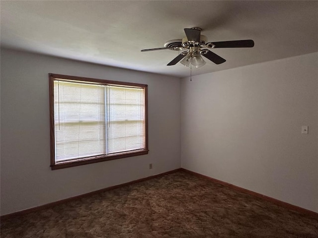 811 N Broadway St, Broken Bow, OK 74728 - unfurnished room featuring carpet flooring, a ceiling fan, and baseboards