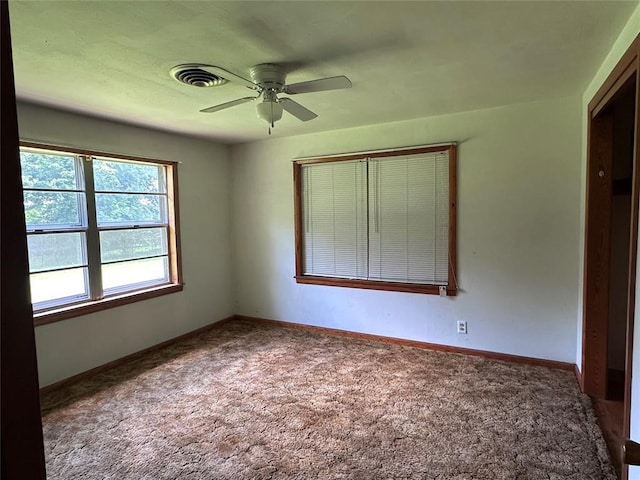 811 N Broadway St, Broken Bow, OK 74728 - carpeted empty room with ceiling fan and baseboards