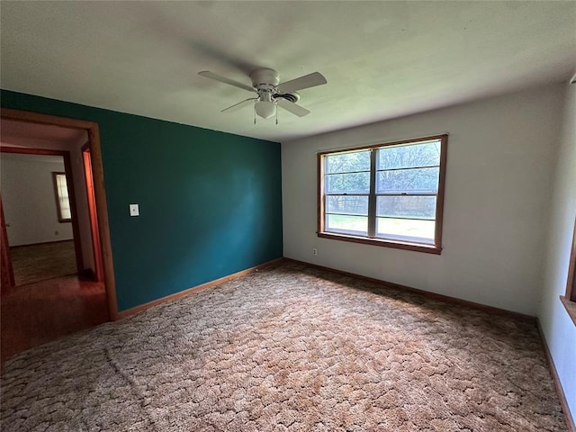 811 N Broadway St, Broken Bow, OK 74728 - spare room with carpet, ceiling fan, and baseboards