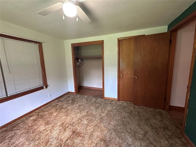 811 N Broadway St, Broken Bow, OK 74728 - unfurnished bedroom featuring carpet flooring, baseboards, a ceiling fan, and multiple closets