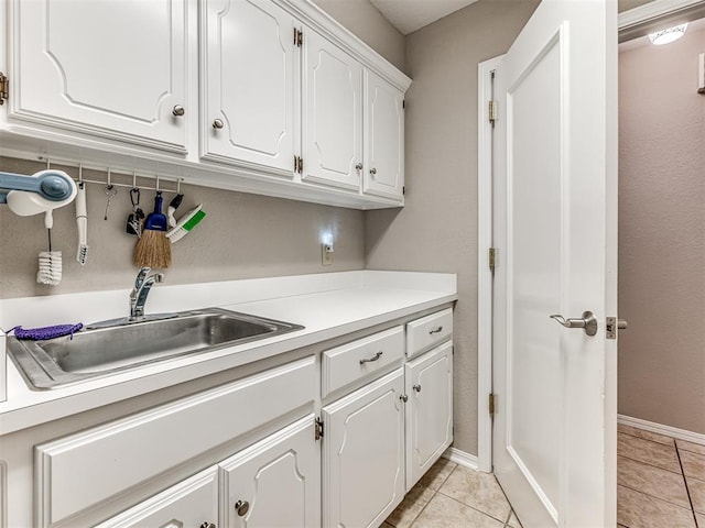 1320 Von Elm Pl, Yukon, OK 73099 - kitchen with a sink, white cabinetry, light countertops, and light tile patterned flooring