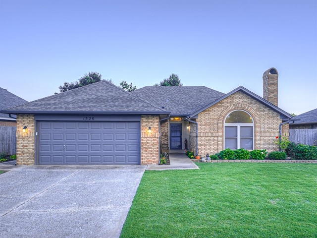 1320 Von Elm Pl, Yukon, OK 73099 - single story home featuring brick siding, driveway, a front yard, and an attached garage