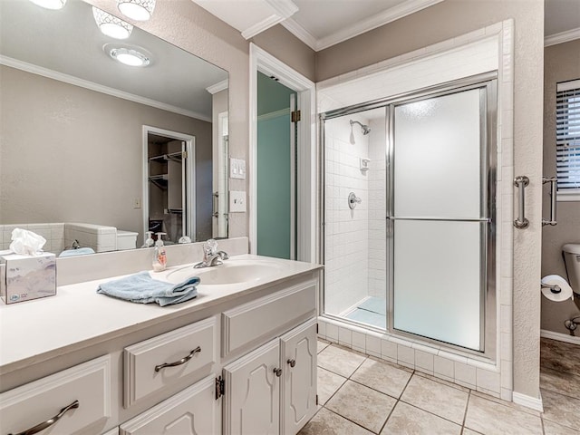 1320 Von Elm Pl, Yukon, OK 73099 - bathroom with vanity, a shower stall, crown molding, tile patterned floors, and toilet
