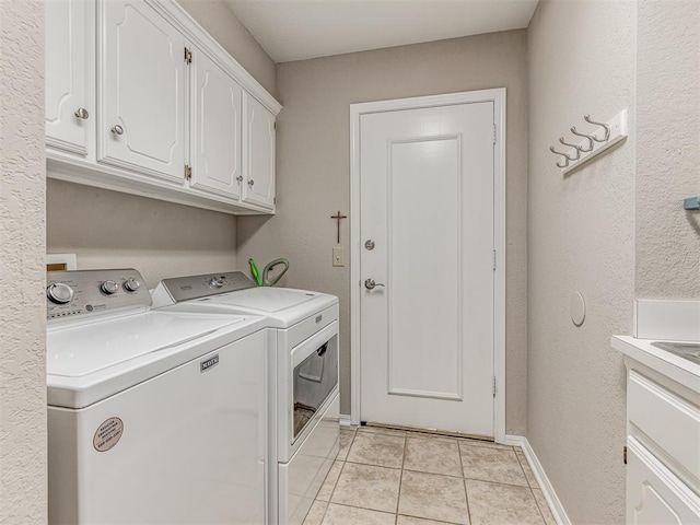 1320 Von Elm Pl, Yukon, OK 73099 - washroom with independent washer and dryer, cabinet space, light tile patterned flooring, and baseboards