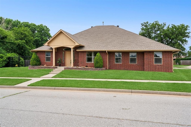 709 S Greengate Dr, Yukon, OK 73099 - view of front facade featuring brick siding and a shingled roof