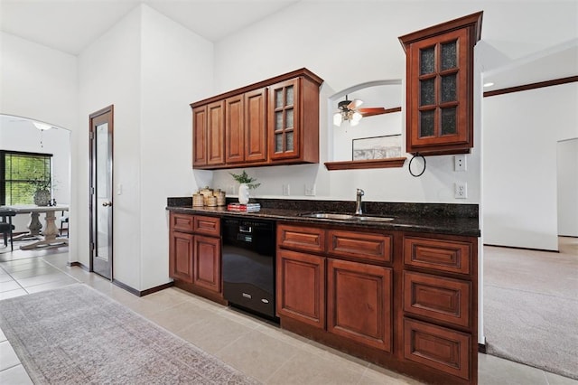 709 S Greengate Dr, Yukon, OK 73099 - kitchen featuring dishwasher, arched walkways, light tile patterned flooring, glass insert cabinets, and dark stone countertops