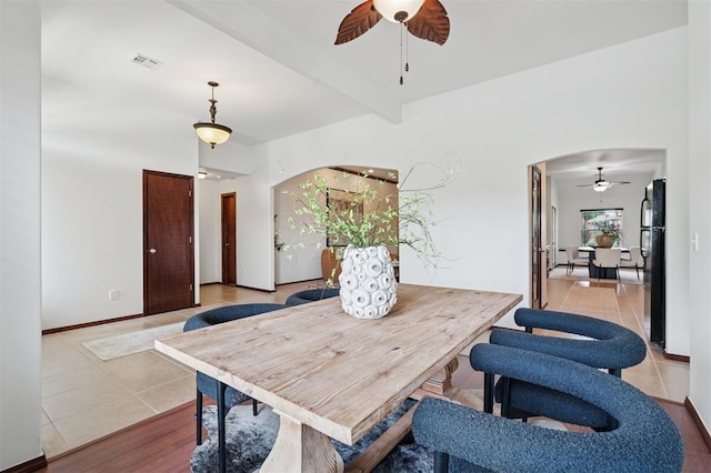 709 S Greengate Dr, Yukon, OK 73099 - dining room featuring ceiling fan, arched walkways, and beamed ceiling