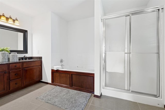 709 S Greengate Dr, Yukon, OK 73099 - bathroom with vanity, a stall shower, a garden tub, and tile patterned floors