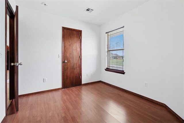 709 S Greengate Dr, Yukon, OK 73099 - unfurnished room featuring wood finished floors and baseboards