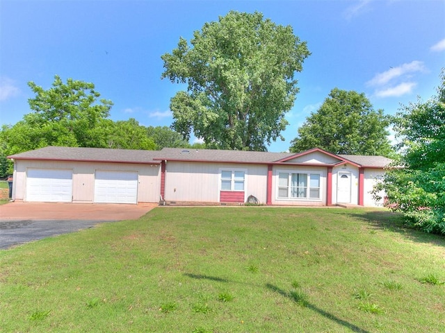 12325 Spring Meadows Rd, Yukon, OK 73099 - ranch-style home with driveway, a front lawn, and an attached garage