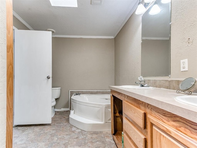 12325 Spring Meadows Rd, Yukon, OK 73099 - bathroom featuring a garden tub, ornamental molding, double vanity, toilet, and a textured wall
