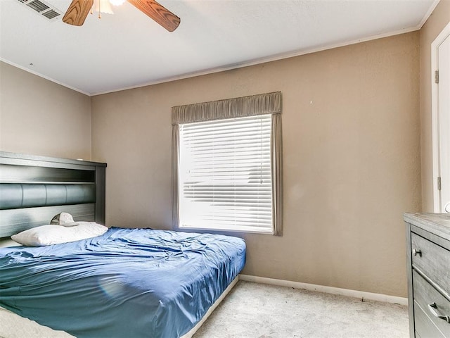 12325 Spring Meadows Rd, Yukon, OK 73099 - bedroom featuring light carpet, ornamental molding, baseboards, multiple windows, and ceiling fan