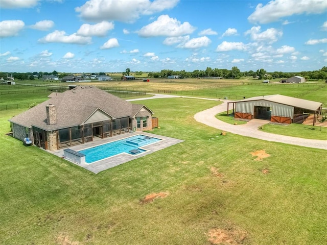 5021 SE 12th Ave, Washington, OK 73093 - view of swimming pool featuring a rural view, an outbuilding, and a pool with connected hot tub