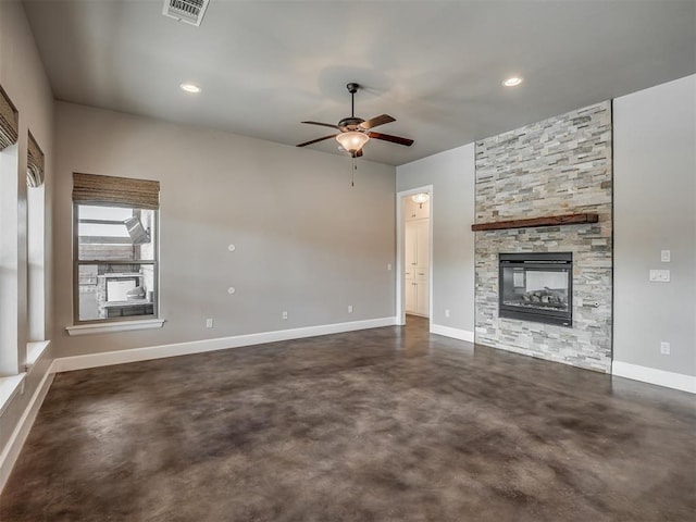5021 SE 12th Ave, Washington, OK 73093 - unfurnished living room featuring concrete floors, ceiling fan, a stone fireplace, and recessed lighting