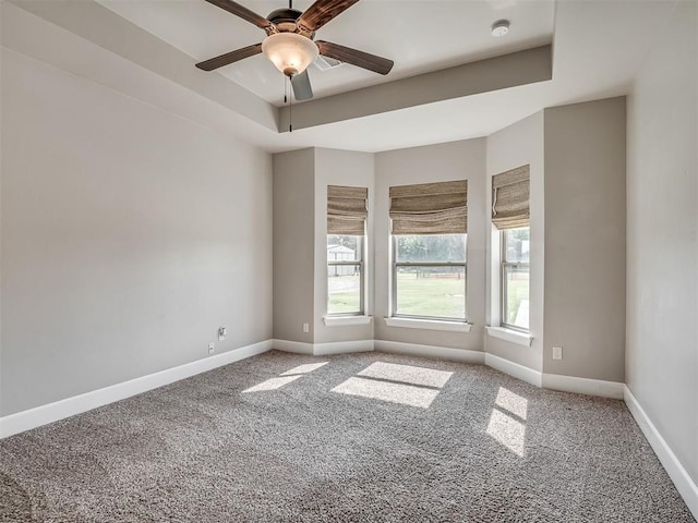 5021 SE 12th Ave, Washington, OK 73093 - spare room with carpet flooring, ceiling fan, a raised ceiling, and a smoke detector