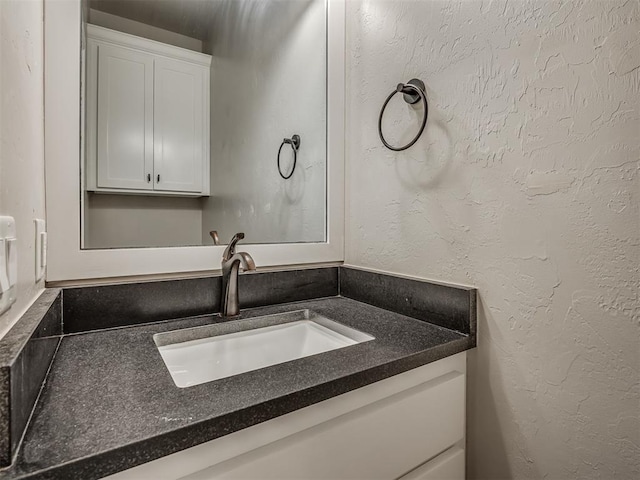 5021 SE 12th Ave, Washington, OK 73093 - bathroom with vanity and a textured wall
