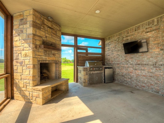 5021 SE 12th Ave, Washington, OK 73093 - view of patio / terrace featuring an outdoor stone fireplace and exterior kitchen