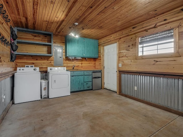 5021 SE 12th Ave, Washington, OK 73093 - laundry room featuring washer and dryer, cabinet space, electric panel, wood walls, and wooden ceiling
