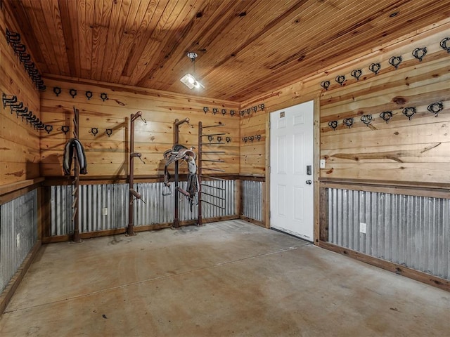 5021 SE 12th Ave, Washington, OK 73093 - unfurnished room featuring concrete floors, wooden walls, and wooden ceiling
