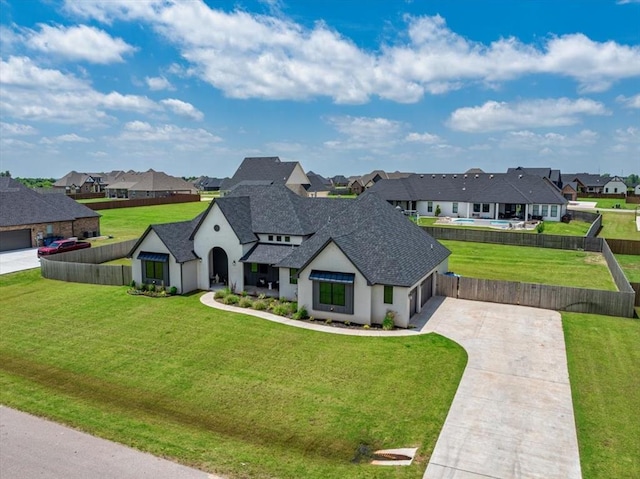 1049 Dorsi Way, Newcastle, OK 73065 - french country home with a residential view, driveway, a shingled roof, stucco siding, and an attached garage
