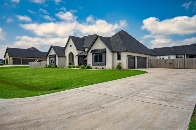 1049 Dorsi Way, Newcastle, OK 73065 - french country home with a garage, driveway, and roof with shingles